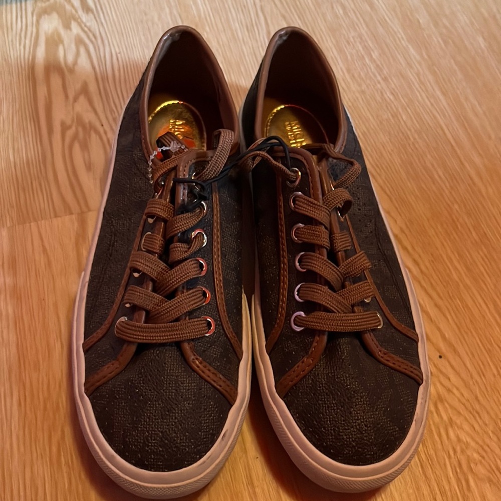 Brown Micheal Kors sneakers . Brand new never been worn, been in storage .